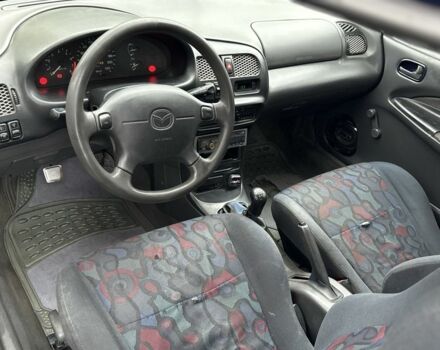 Синій Мазда 323, об'ємом двигуна 1.5 л та пробігом 200 тис. км за 1000 $, фото 5 на Automoto.ua