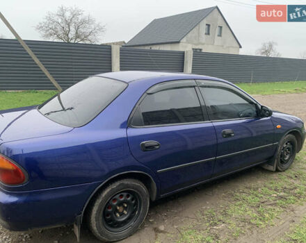 Синій Мазда 323, об'ємом двигуна 1.5 л та пробігом 419 тис. км за 1700 $, фото 7 на Automoto.ua