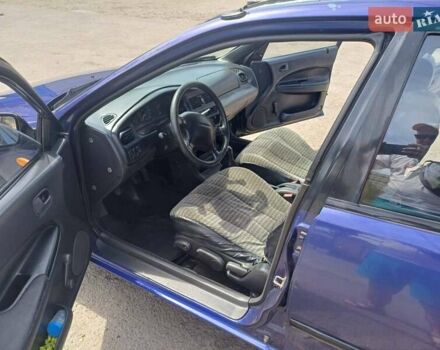 Синий Мазда 323, объемом двигателя 1.5 л и пробегом 295 тыс. км за 2300 $, фото 20 на Automoto.ua
