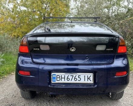 Синій Мазда 323, об'ємом двигуна 1.5 л та пробігом 200 тис. км за 1000 $, фото 4 на Automoto.ua