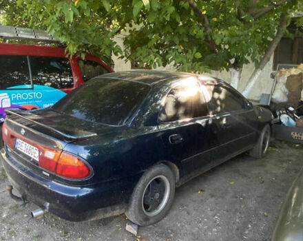 Синій Мазда 323, об'ємом двигуна 1.3 л та пробігом 395 тис. км за 1750 $, фото 5 на Automoto.ua