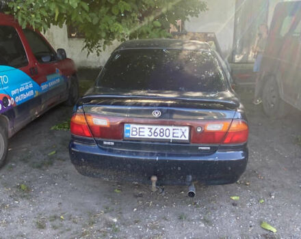 Синій Мазда 323, об'ємом двигуна 1.3 л та пробігом 395 тис. км за 1750 $, фото 2 на Automoto.ua
