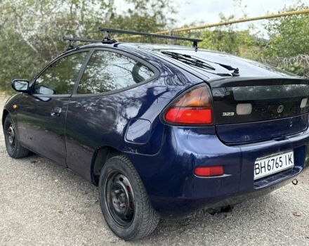 Синій Мазда 323, об'ємом двигуна 1.5 л та пробігом 200 тис. км за 1000 $, фото 3 на Automoto.ua