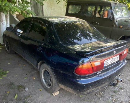 Синій Мазда 323, об'ємом двигуна 1.3 л та пробігом 395 тис. км за 1750 $, фото 1 на Automoto.ua