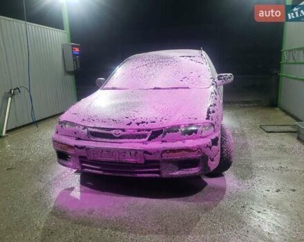 Синий Мазда 323, объемом двигателя 1.5 л и пробегом 430 тыс. км за 1300 $, фото 2 на Automoto.ua