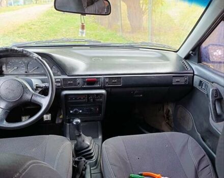 Синий Мазда 323, объемом двигателя 1.69 л и пробегом 250 тыс. км за 750 $, фото 1 на Automoto.ua