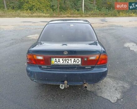 Синий Мазда 323, объемом двигателя 1.49 л и пробегом 250 тыс. км за 1450 $, фото 1 на Automoto.ua