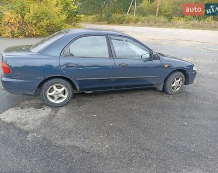 Синий Мазда 323, объемом двигателя 1.49 л и пробегом 250 тыс. км за 1450 $, фото 3 на Automoto.ua