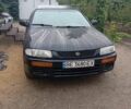Синій Мазда 323, об'ємом двигуна 1.3 л та пробігом 300 тис. км за 2198 $, фото 1 на Automoto.ua