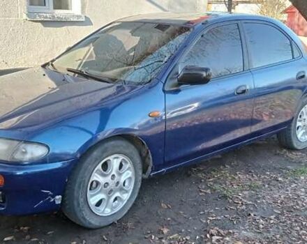 Синий Мазда 323, объемом двигателя 1.5 л и пробегом 400 тыс. км за 1300 $, фото 11 на Automoto.ua