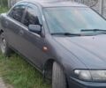 Синий Мазда 323, объемом двигателя 1.8 л и пробегом 340 тыс. км за 1014 $, фото 1 на Automoto.ua