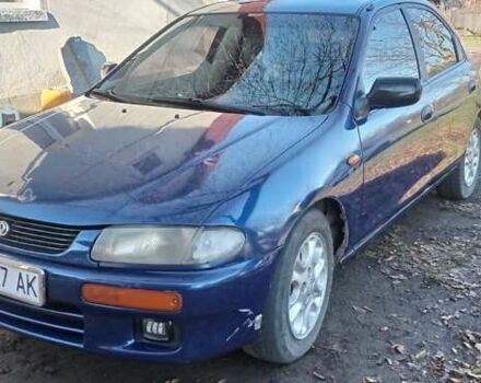 Синий Мазда 323, объемом двигателя 1.5 л и пробегом 400 тыс. км за 1300 $, фото 4 на Automoto.ua