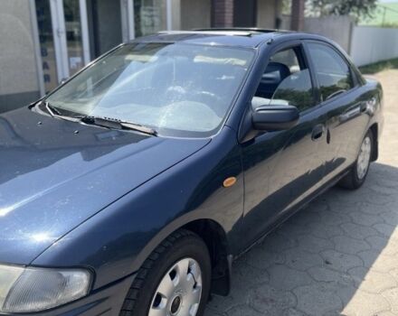 Синій Мазда 323, об'ємом двигуна 1.5 л та пробігом 1000 тис. км за 1100 $, фото 1 на Automoto.ua