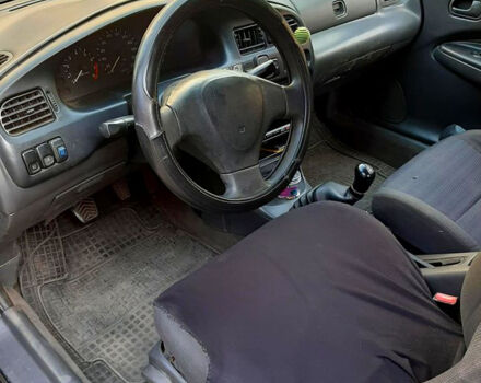 Синий Мазда 323, объемом двигателя 1.5 л и пробегом 402 тыс. км за 2500 $, фото 5 на Automoto.ua