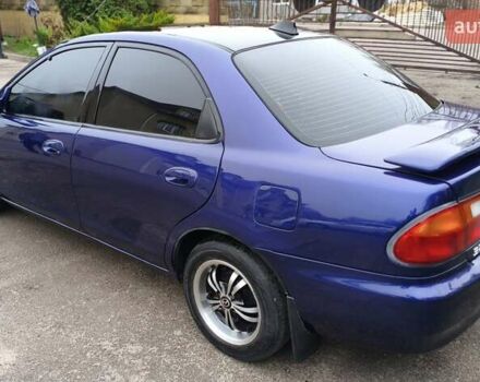 Синий Мазда 323, объемом двигателя 1.5 л и пробегом 342 тыс. км за 2600 $, фото 2 на Automoto.ua