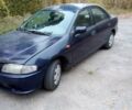 Синий Мазда 323, объемом двигателя 1.5 л и пробегом 294 тыс. км за 1100 $, фото 1 на Automoto.ua