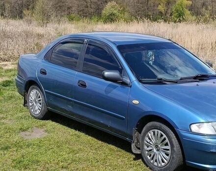 Синій Мазда 323, об'ємом двигуна 1.5 л та пробігом 312 тис. км за 2200 $, фото 2 на Automoto.ua