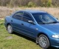 Синій Мазда 323, об'ємом двигуна 1.5 л та пробігом 312 тис. км за 2200 $, фото 2 на Automoto.ua
