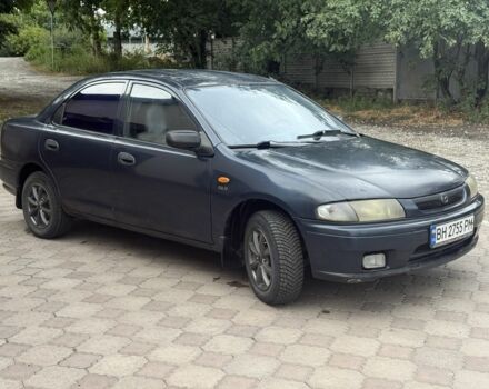 Синий Мазда 323, объемом двигателя 1.5 л и пробегом 444 тыс. км за 1375 $, фото 2 на Automoto.ua