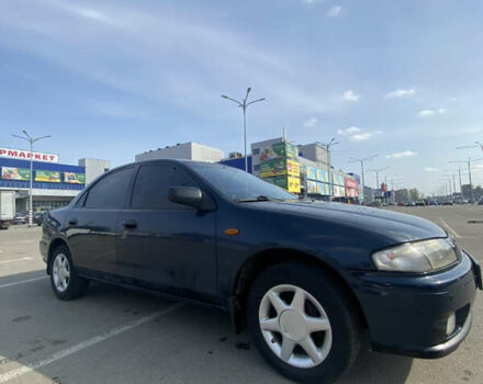 Синий Мазда 323, объемом двигателя 1.5 л и пробегом 330 тыс. км за 3000 $, фото 2 на Automoto.ua