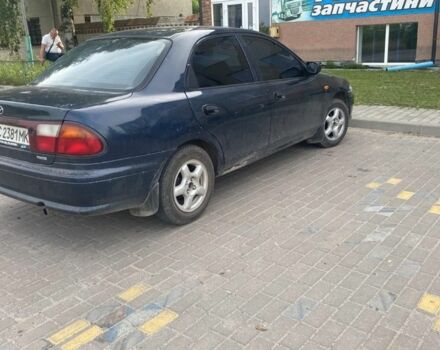 Синий Мазда 323, объемом двигателя 1.5 л и пробегом 430 тыс. км за 2200 $, фото 1 на Automoto.ua