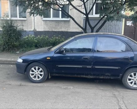Синій Мазда 323, об'ємом двигуна 1.5 л та пробігом 300 тис. км за 2000 $, фото 1 на Automoto.ua