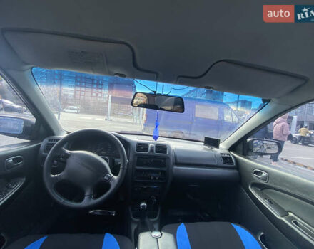 Синий Мазда 323, объемом двигателя 1.5 л и пробегом 330 тыс. км за 3000 $, фото 13 на Automoto.ua