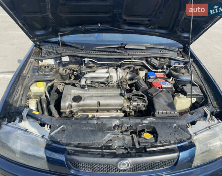 Синий Мазда 323, объемом двигателя 1.5 л и пробегом 330 тыс. км за 3000 $, фото 16 на Automoto.ua