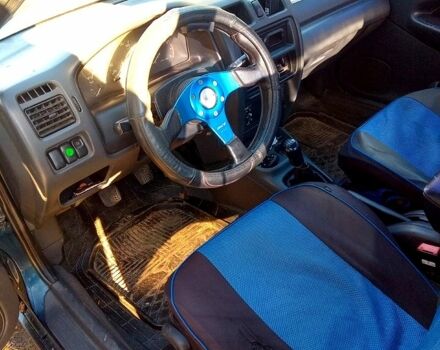 Синий Мазда 323, объемом двигателя 1.5 л и пробегом 300 тыс. км за 1750 $, фото 1 на Automoto.ua