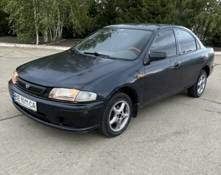 Синий Мазда 323, объемом двигателя 1.5 л и пробегом 200 тыс. км за 1350 $, фото 1 на Automoto.ua