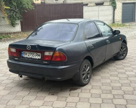 Синий Мазда 323, объемом двигателя 1.5 л и пробегом 444 тыс. км за 1375 $, фото 4 на Automoto.ua