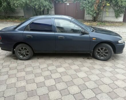 Синий Мазда 323, объемом двигателя 1.5 л и пробегом 444 тыс. км за 1375 $, фото 3 на Automoto.ua