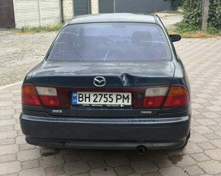 Синий Мазда 323, объемом двигателя 1.5 л и пробегом 444 тыс. км за 1375 $, фото 5 на Automoto.ua