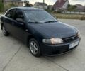 Синий Мазда 323, объемом двигателя 1.5 л и пробегом 200 тыс. км за 1350 $, фото 1 на Automoto.ua