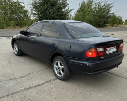 Синий Мазда 323, объемом двигателя 1.5 л и пробегом 200 тыс. км за 1350 $, фото 2 на Automoto.ua