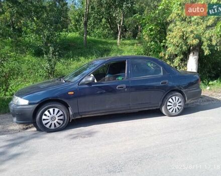 Синий Мазда 323, объемом двигателя 1.5 л и пробегом 510 тыс. км за 1750 $, фото 2 на Automoto.ua
