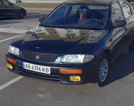 Синій Мазда 323, об'ємом двигуна 1.5 л та пробігом 272 тис. км за 1400 $, фото 4 на Automoto.ua