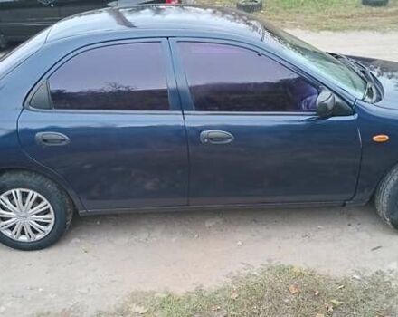 Синій Мазда 323, об'ємом двигуна 1.5 л та пробігом 70 тис. км за 1950 $, фото 4 на Automoto.ua