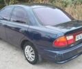Синий Мазда 323, объемом двигателя 1.5 л и пробегом 74 тыс. км за 1950 $, фото 2 на Automoto.ua