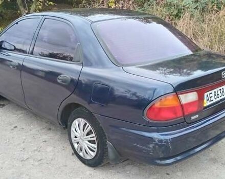 Синій Мазда 323, об'ємом двигуна 1.5 л та пробігом 70 тис. км за 1950 $, фото 2 на Automoto.ua