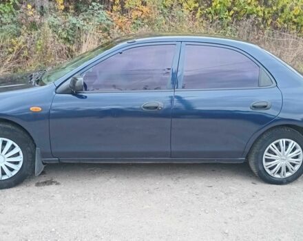 Синий Мазда 323, объемом двигателя 1.5 л и пробегом 74 тыс. км за 1950 $, фото 1 на Automoto.ua