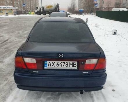 Синий Мазда 323, объемом двигателя 1.84 л и пробегом 299 тыс. км за 2000 $, фото 1 на Automoto.ua
