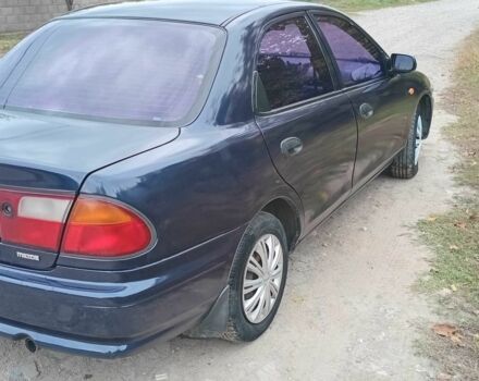 Синий Мазда 323, объемом двигателя 1.5 л и пробегом 74 тыс. км за 1950 $, фото 3 на Automoto.ua