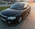 Синий Мазда 323, объемом двигателя 1.3 л и пробегом 222 тыс. км за 2100 $, фото 1 на Automoto.ua
