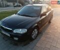 Синій Мазда 323, об'ємом двигуна 1.3 л та пробігом 222 тис. км за 2100 $, фото 1 на Automoto.ua