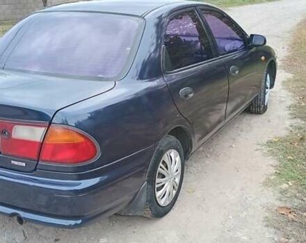 Синій Мазда 323, об'ємом двигуна 1.5 л та пробігом 70 тис. км за 1950 $, фото 3 на Automoto.ua