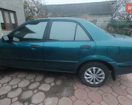 Синий Мазда 323, объемом двигателя 1.5 л и пробегом 280 тыс. км за 2700 $, фото 2 на Automoto.ua