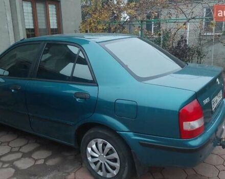 Синий Мазда 323, объемом двигателя 1.5 л и пробегом 280 тыс. км за 2700 $, фото 1 на Automoto.ua