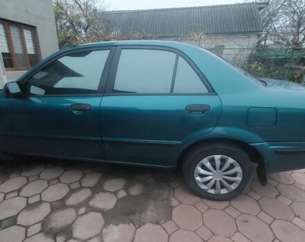Синий Мазда 323, объемом двигателя 1.5 л и пробегом 280 тыс. км за 2700 $, фото 2 на Automoto.ua
