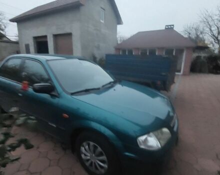 Синий Мазда 323, объемом двигателя 1.5 л и пробегом 280 тыс. км за 2700 $, фото 4 на Automoto.ua